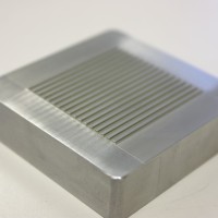Wire EDM machining in aluminum electronic component. Wire EDM machining in aluminum electronic component.