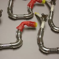 Resistance stitch welding of fuel delivery tube assembly. Resistance stitch welding of fuel delivery tube assembly.
